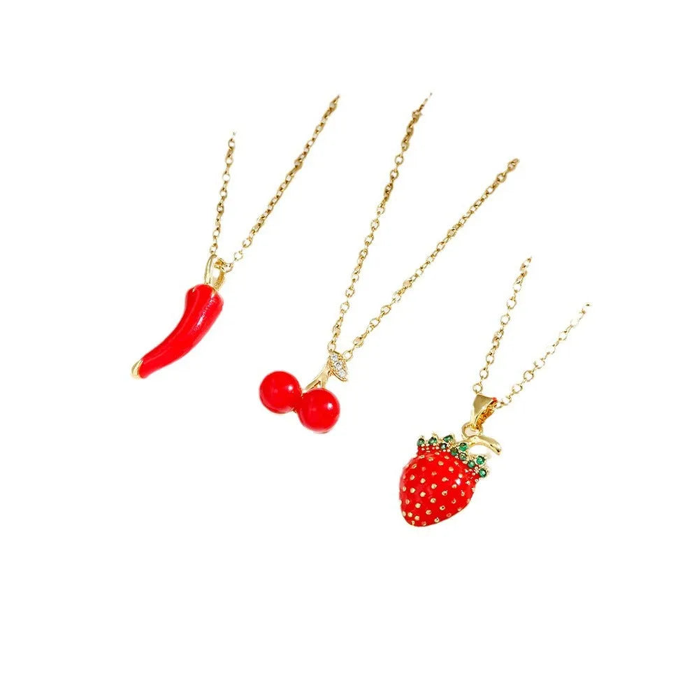 Delicate red indie cherry and strawberry pendant on a titanium steel O-ring necklace chain.