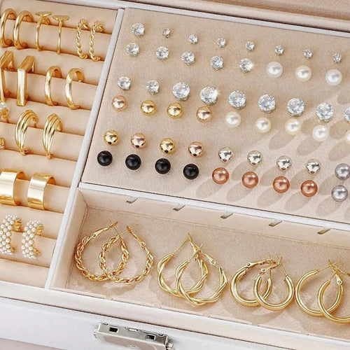 Assortment of 108 gold and yellow geometric alloy earrings with round pearl-like details on a white background.