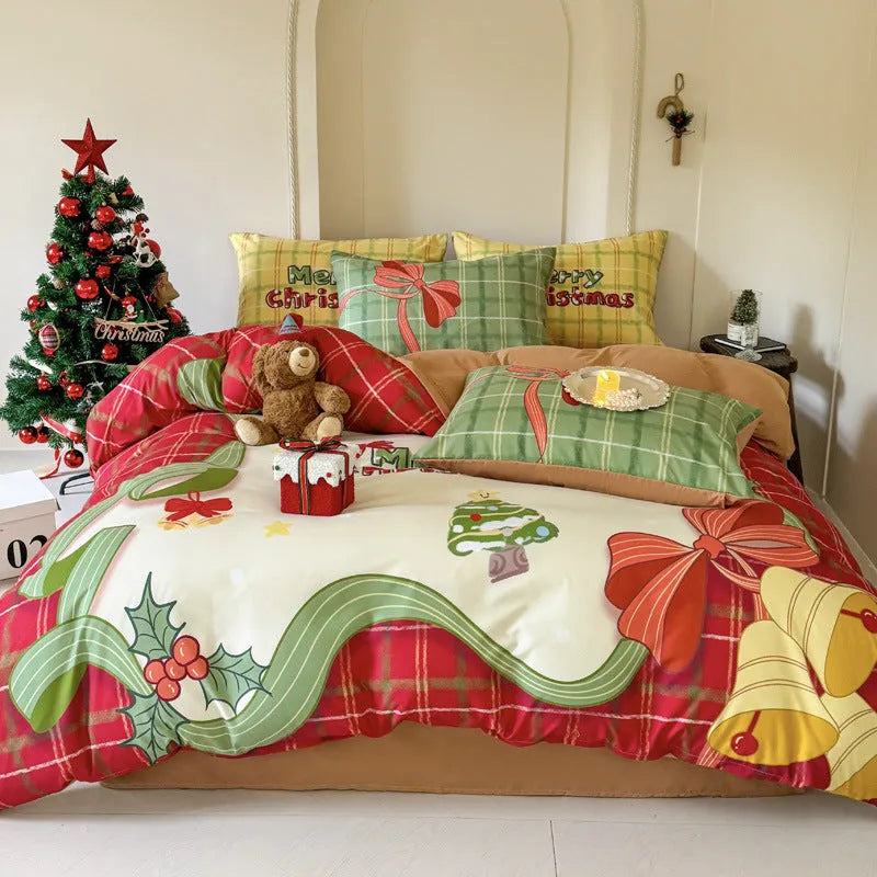 Christmas cartoon print bedding four-piece set on a bed, showing duvet cover and pillowcases in a festive pattern.