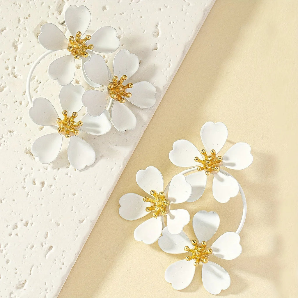 Retro flower-shaped iron earrings for women in black or white with baking varnish finish.