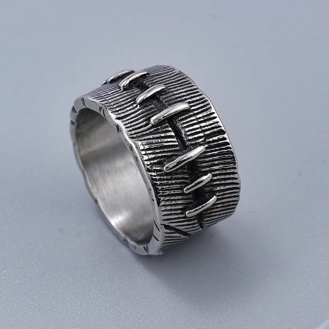 Geometric titanium steel dark punk double ring in a U-shape, shown in a retro colour.
