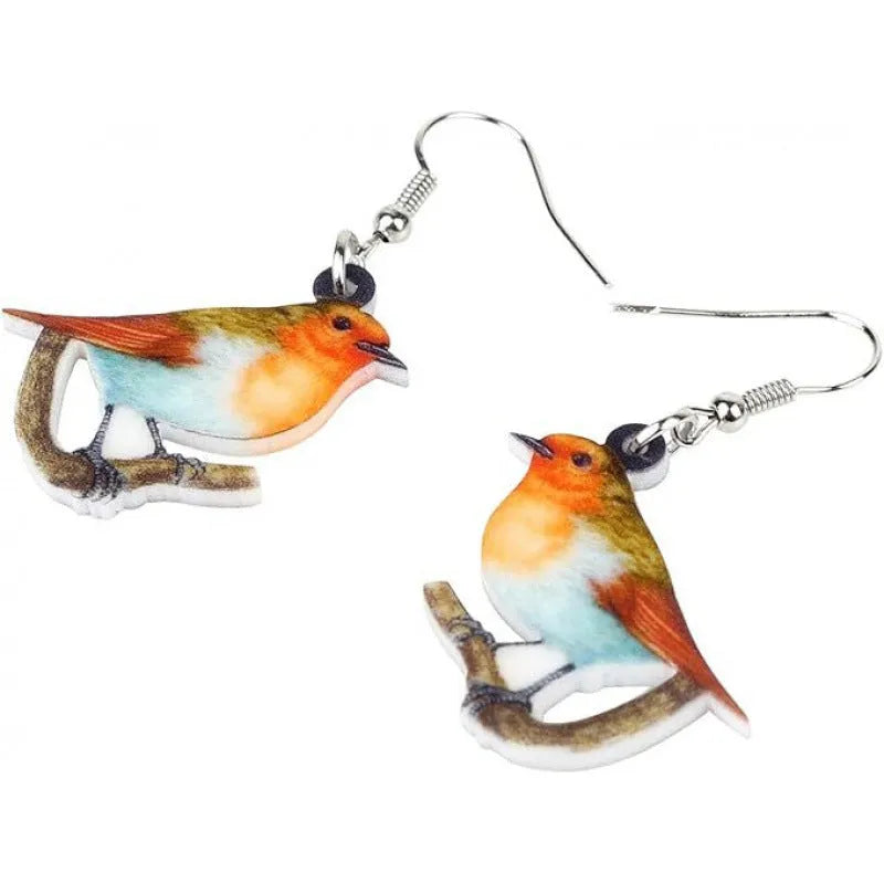 Pair of blue and white acrylic pendant earrings featuring a printed titmouse bird and snake design on geometric shapes.