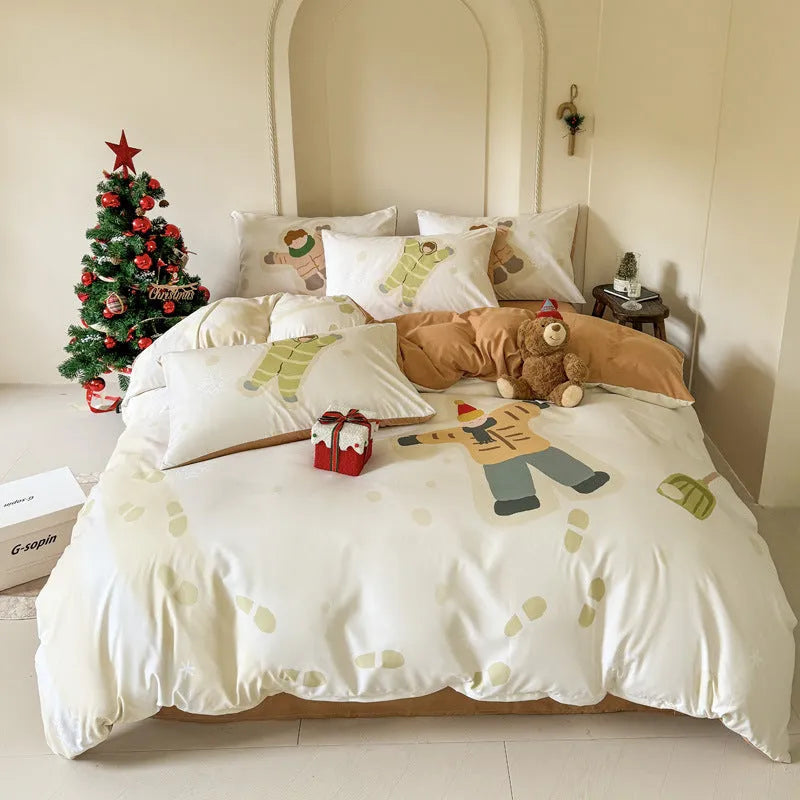 Christmas cartoon print bedding four-piece set on a bed, showing duvet cover and pillowcases in a festive pattern.