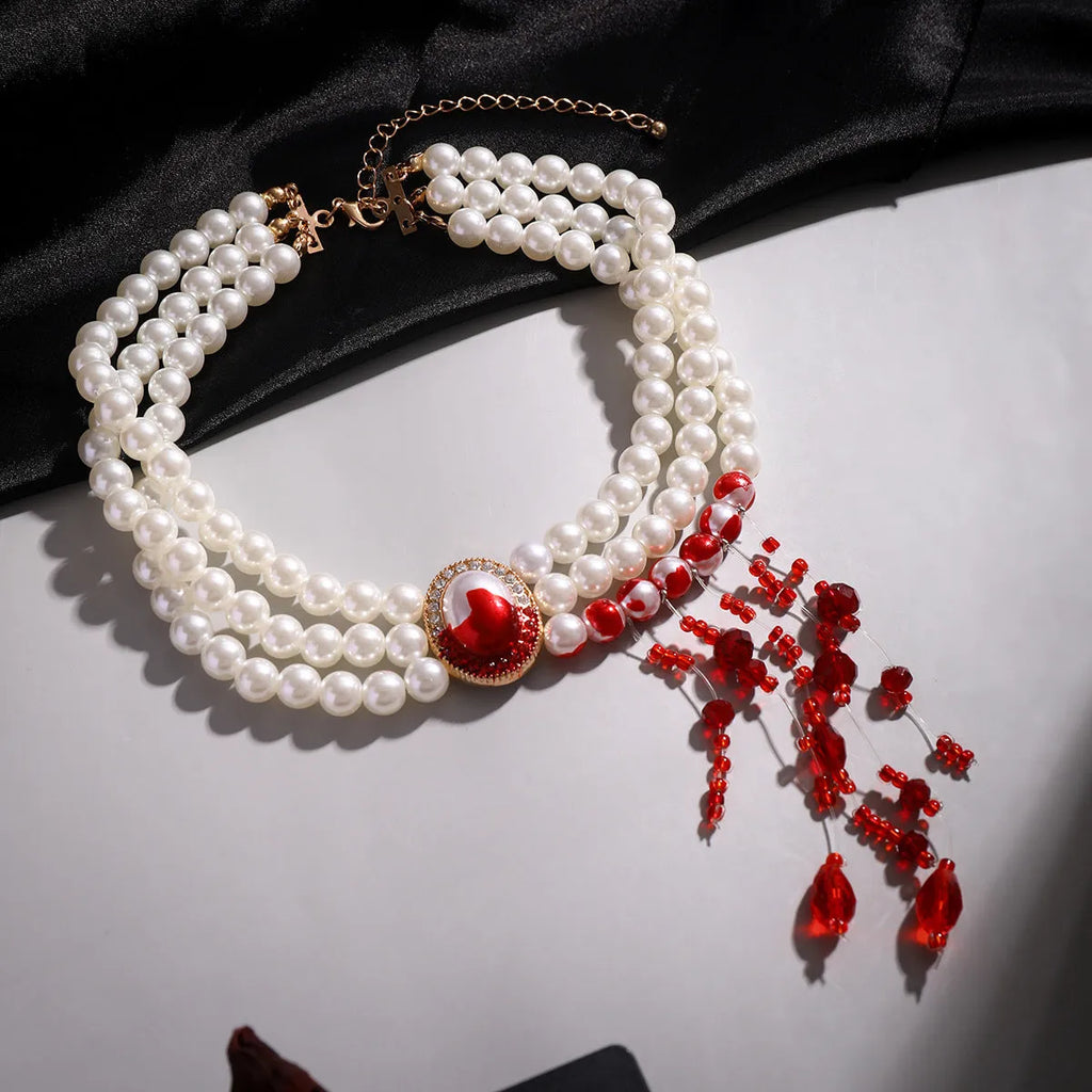 Halloween jewellery set with gold tone necklace, bracelet, and earrings featuring pearl accents