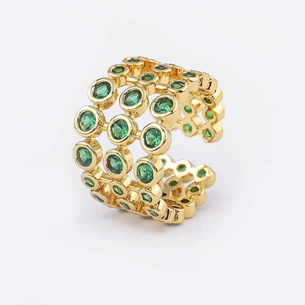 Copper ring with 18K gold plating and green zircon stones in exaggerated wide-band design