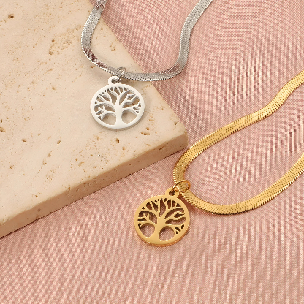Gold and steel colour adjustable lucky tree pendant necklaces on a snake bones chain.
