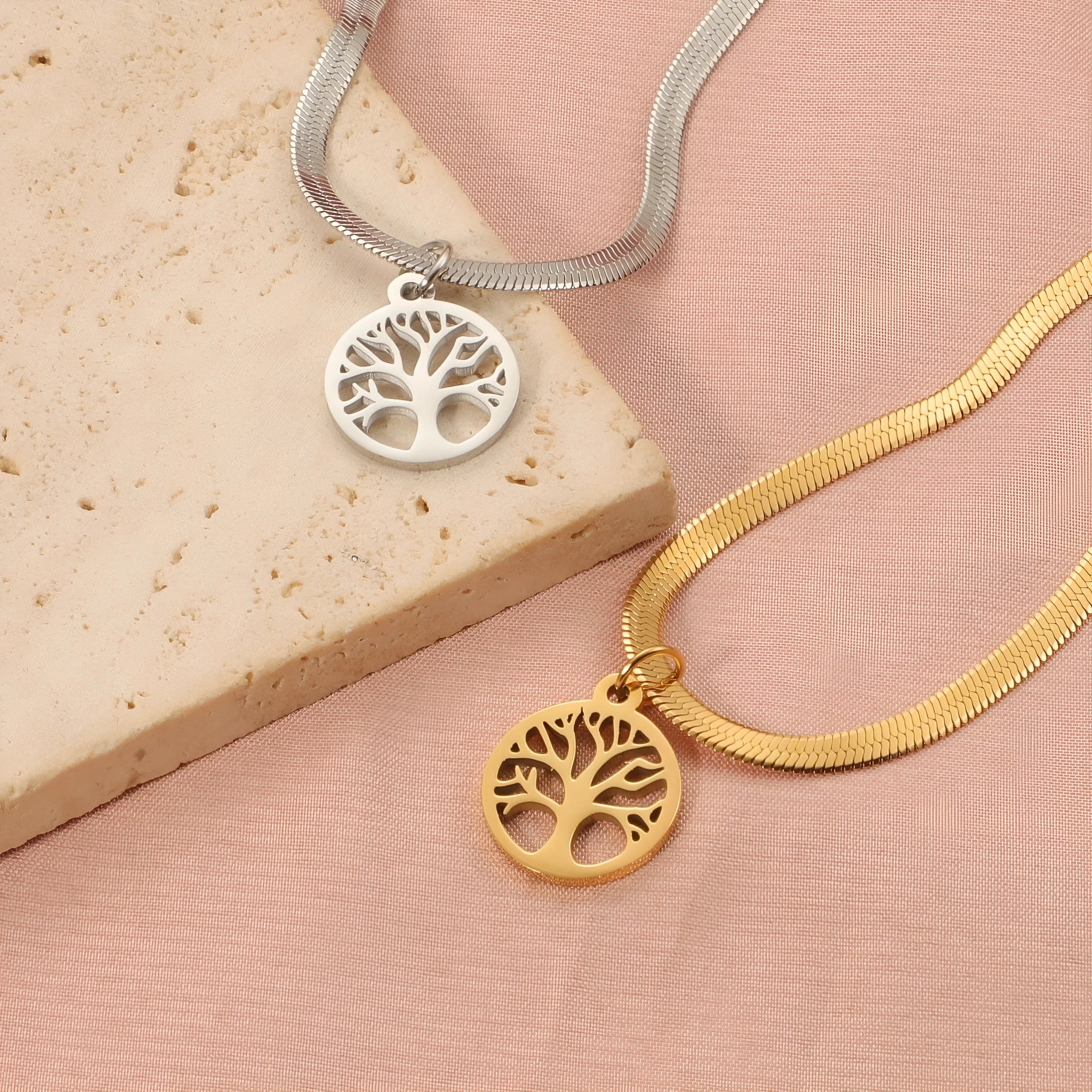 Gold and steel colour adjustable lucky tree pendant necklaces on a snake bones chain.