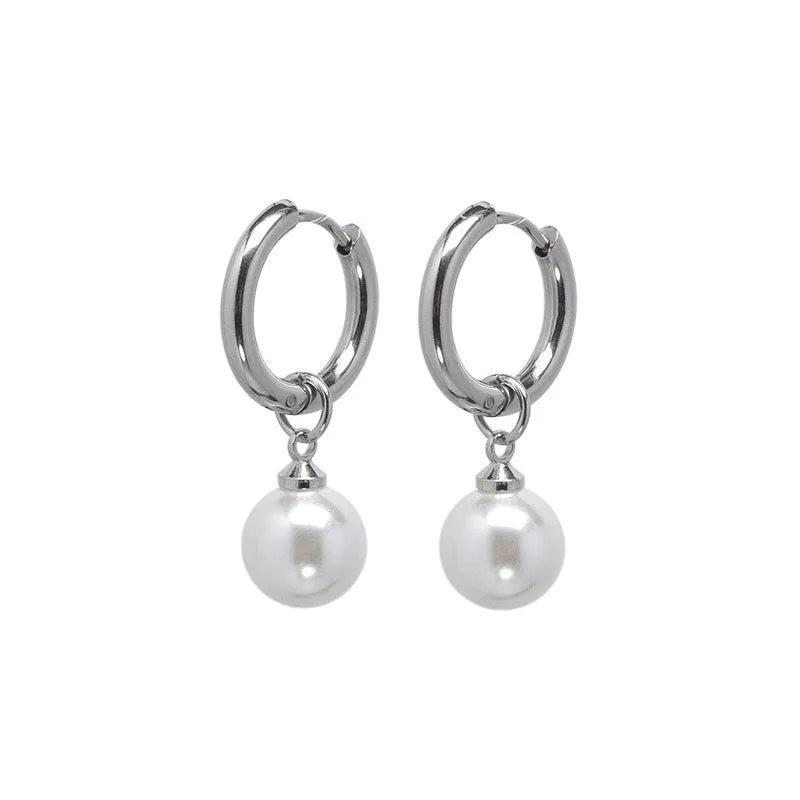 Geometric pearl earrings with titanium steel components and round pearl detailing