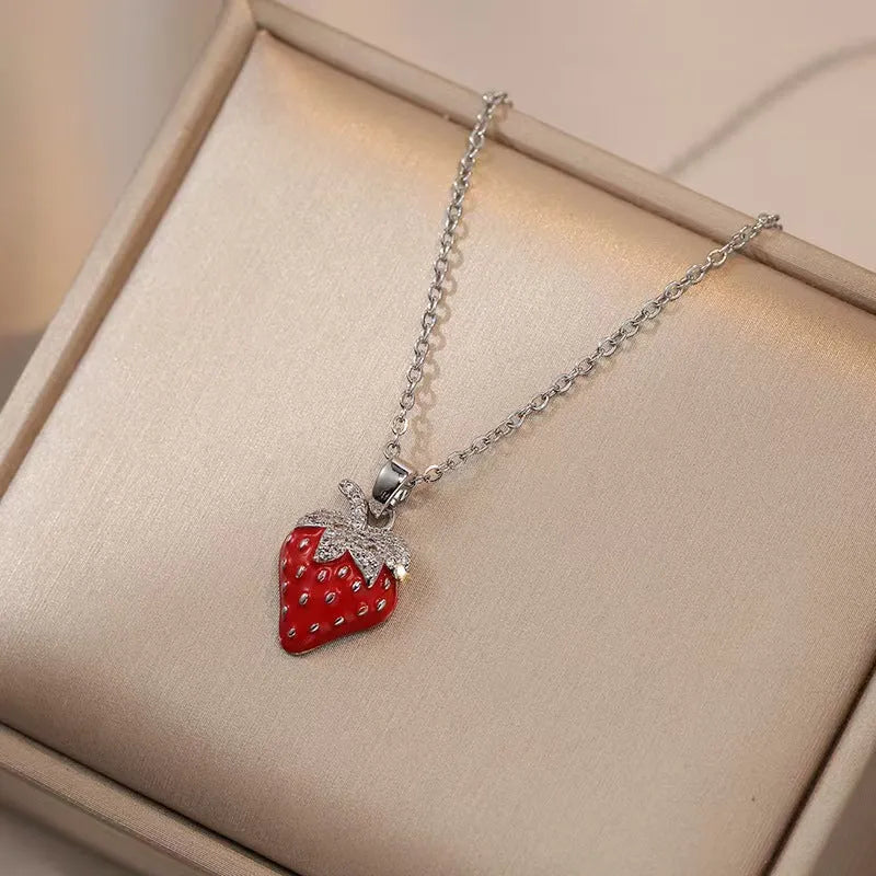 Delicate red indie cherry and strawberry pendant on a titanium steel O-ring necklace chain.