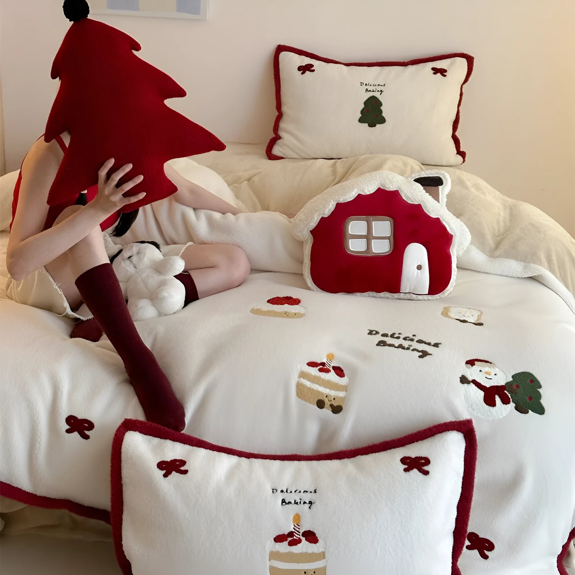 Cartoon winter Christmas themed bedding four-piece set including duvet cover, bed sheet, and two pillowcases made from polyester.