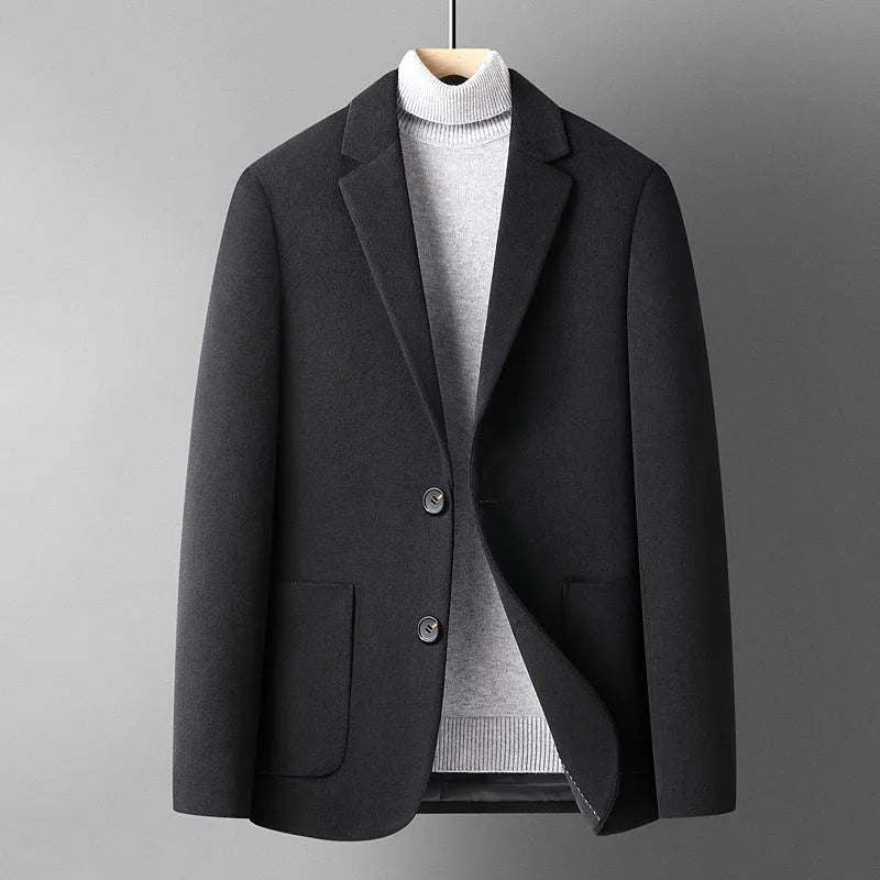 Men's grey slim fit wool suit jacket with a non-ironing finish on a hanger.