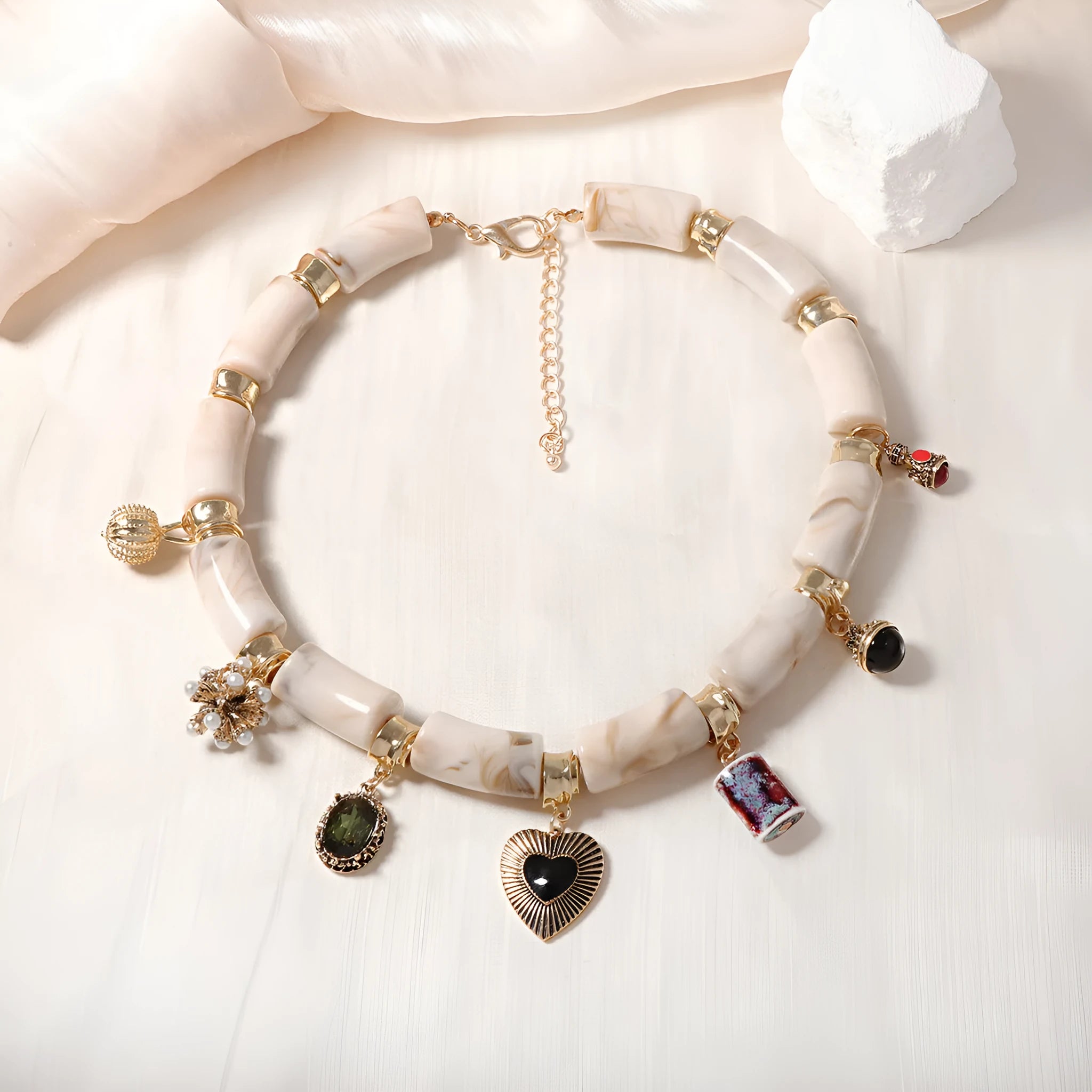 Heart-shaped resin pendant necklace with bamboo detail and adjustable chain