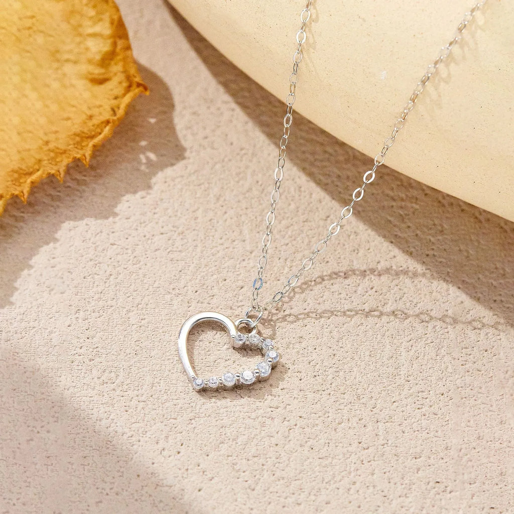 S925 sterling silver hollow heart pendant necklace with regular chain, available in white gold or 18K gold finish.