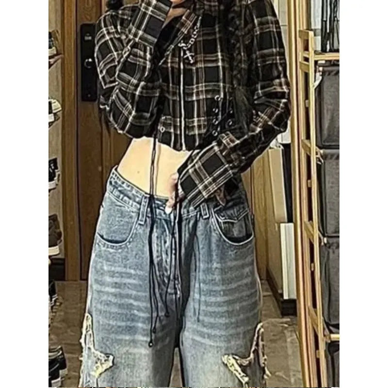 Blue high-waisted straight-leg women's jeans on a neutral background.
