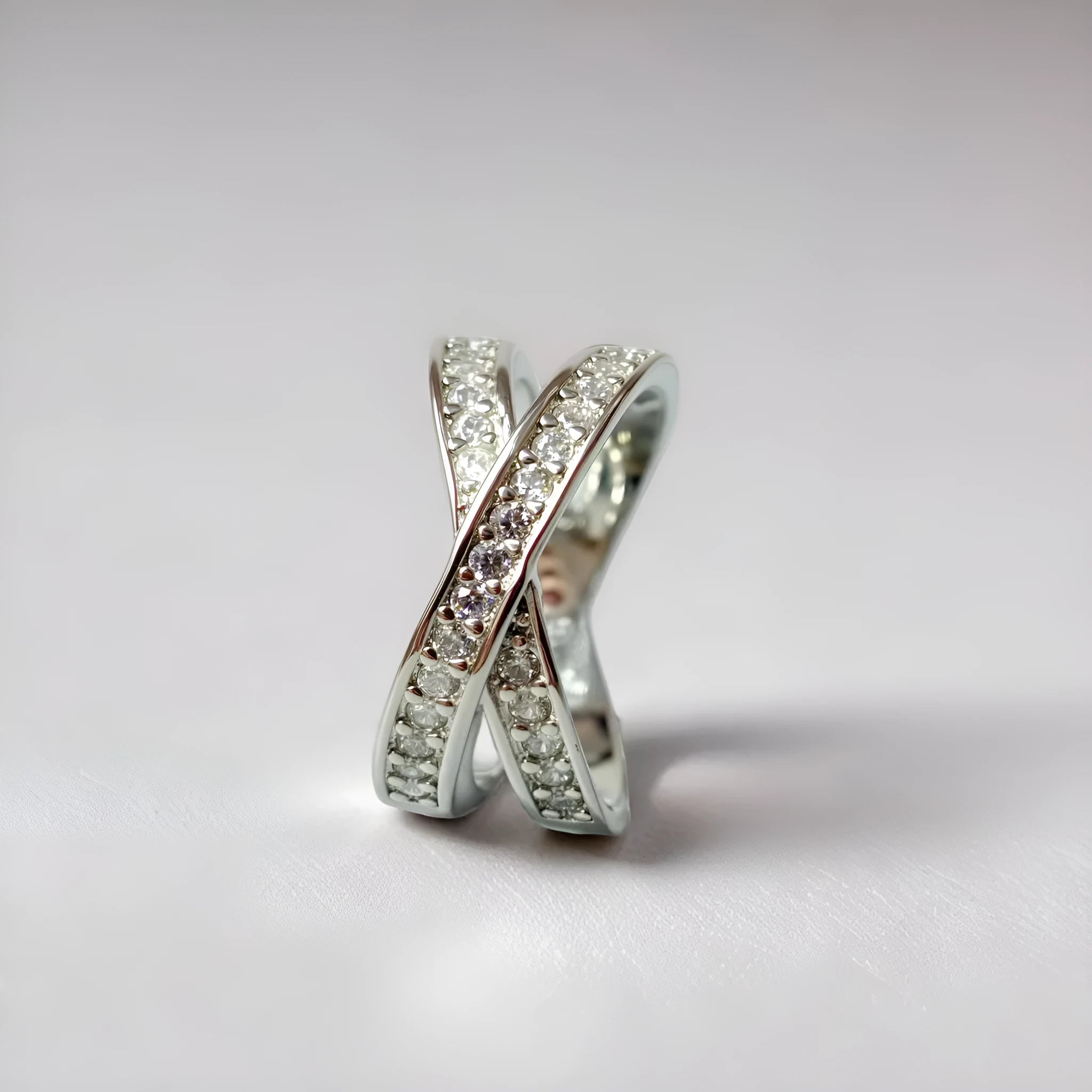 Copper ring with a metal cross design, micro-inlaid zircon, and electroplated silver or rose gold finish.