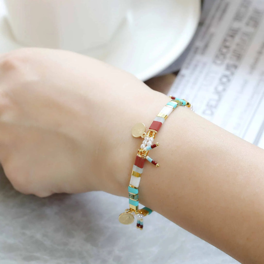 Women's handmade bracelet with imitation pearls and coloured glass beads in European and American jewellery style