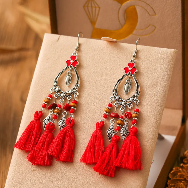 Metal leaf shaped drop earrings with multi-layer tassel and irregular stone ornament in electroplated finish