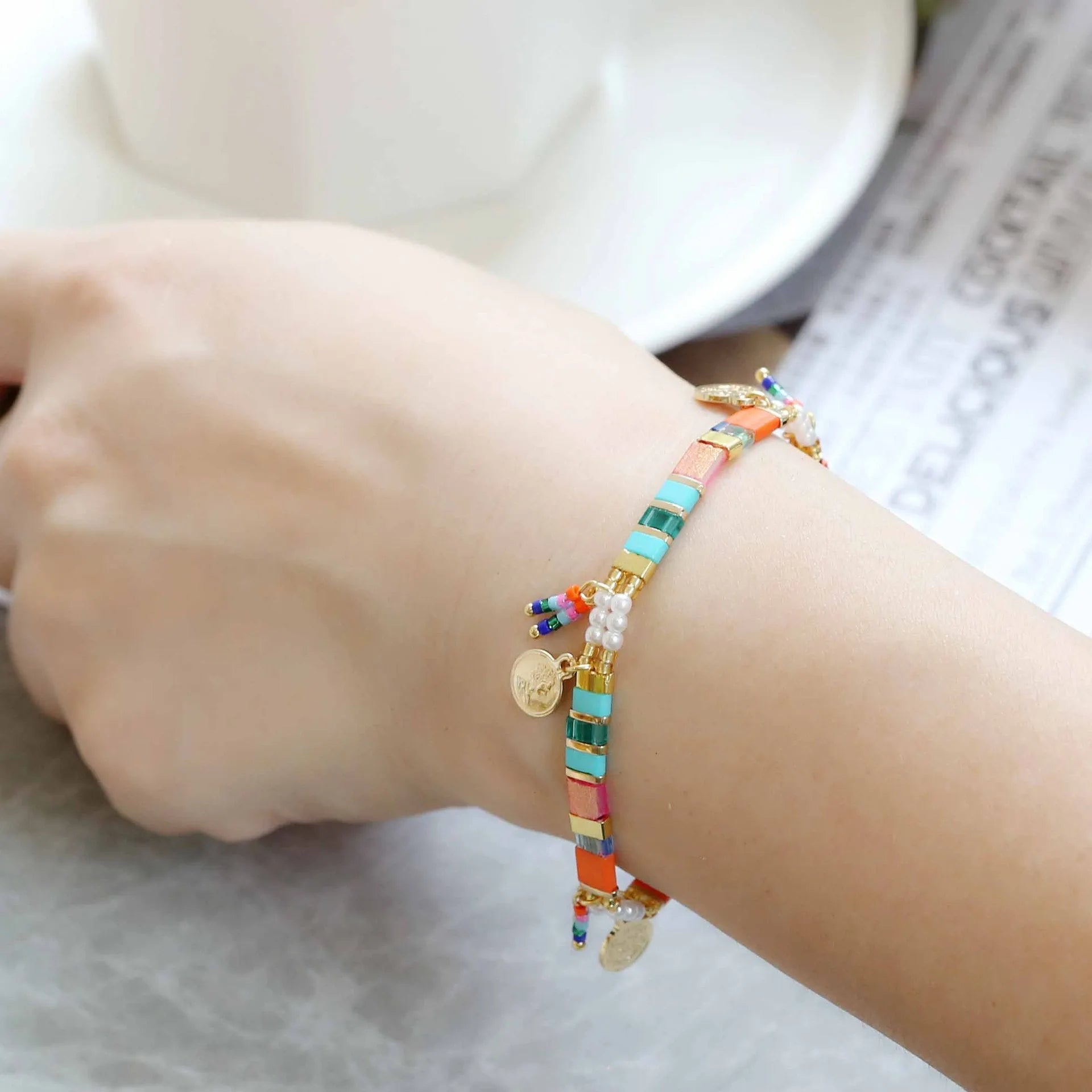 Women's handmade bracelet with imitation pearls and coloured glass beads in European and American jewellery style