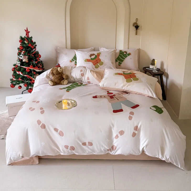 Christmas cartoon print bedding four-piece set on a bed, showing duvet cover and pillowcases in a festive pattern.