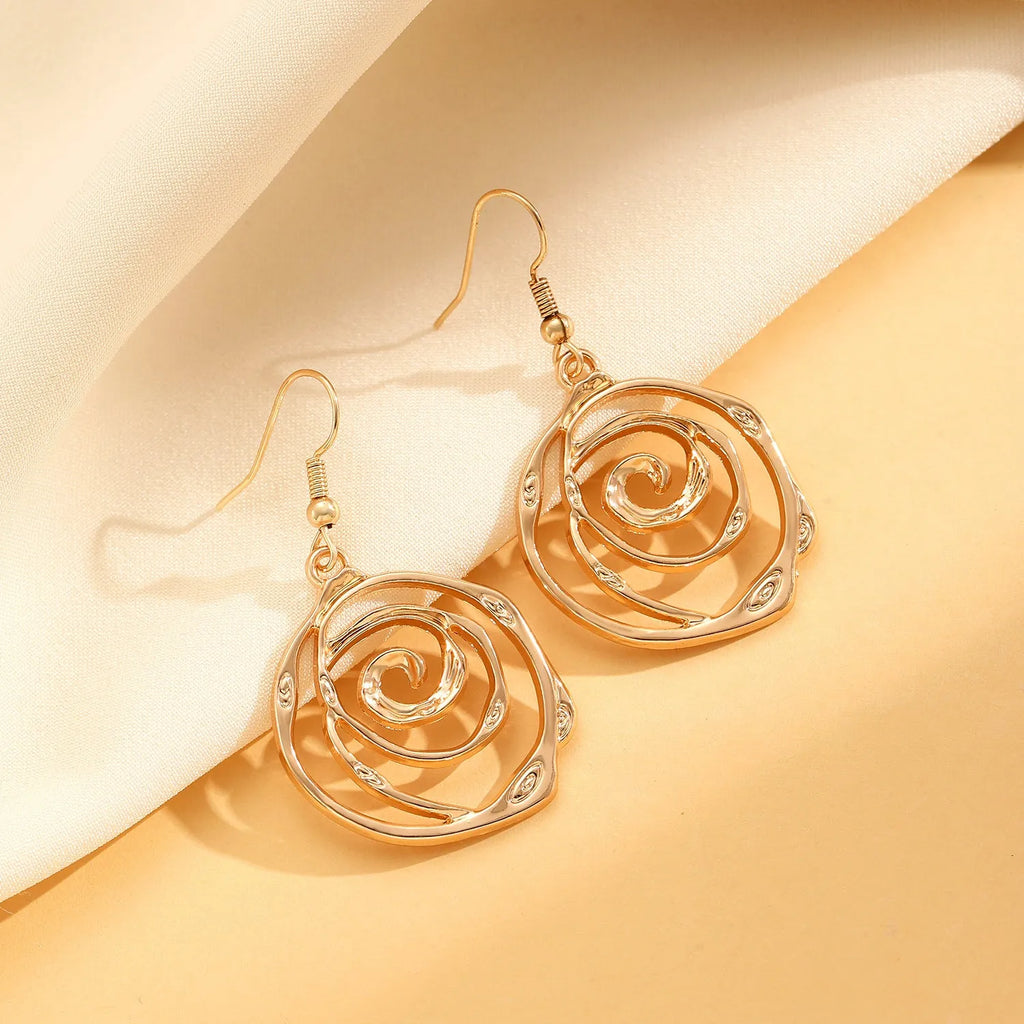Spiral donut women's jewellery set showing necklace, bracelet, and earrings with geometry circle design