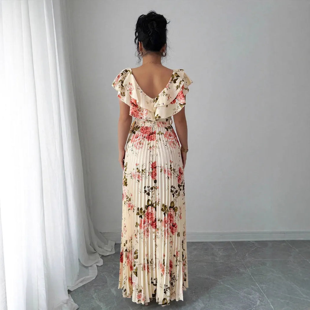 Apricot floral print women's dress with V-neck, ruffled short sleeves, and a high-waisted oversized skirt.