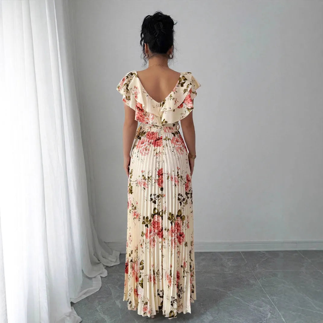 Apricot floral print women's dress with V-neck, ruffled short sleeves, and a high-waisted oversized skirt.