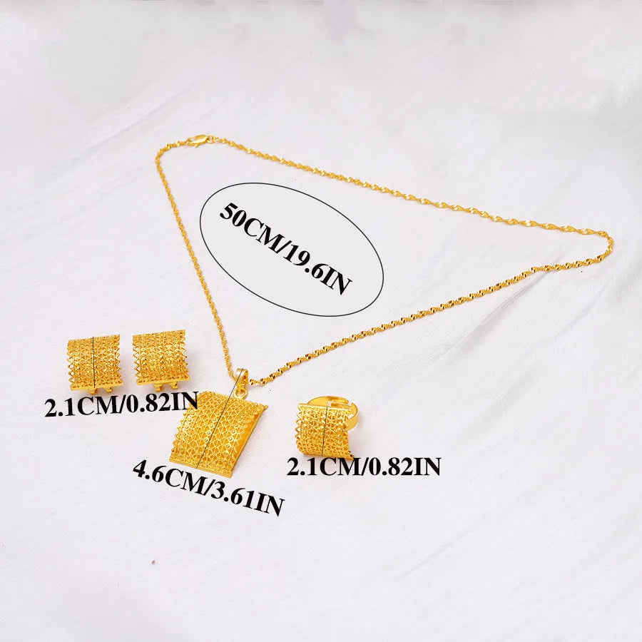 Golden bridal jewellery set comprising a copper necklace, earrings, and ring on a display.