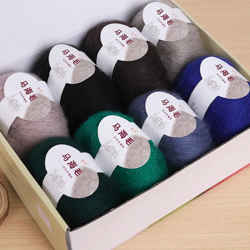 A 200g ball of mohair Inverness thread in a chosen colour, next to a measuring tape showing 180cm for the finished scarf length.