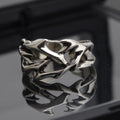 Copper men's ring with geometric thorn flower design and adjustable opening in J2150 thorns colour.