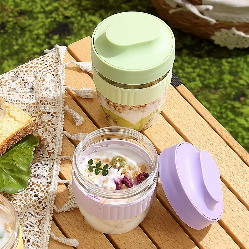 Green microwave-safe plastic salad cup with white lid and spoon, showing leak-proof seal.