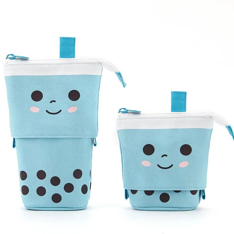 Canvas retractable pencil case with heart smiley face design in blue velvet milk tea colour, showing retractable pen holder