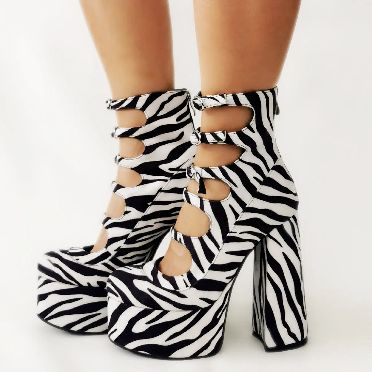 Black women's platform high heels with a thick heel, serpentine ankle strap, and round toe.