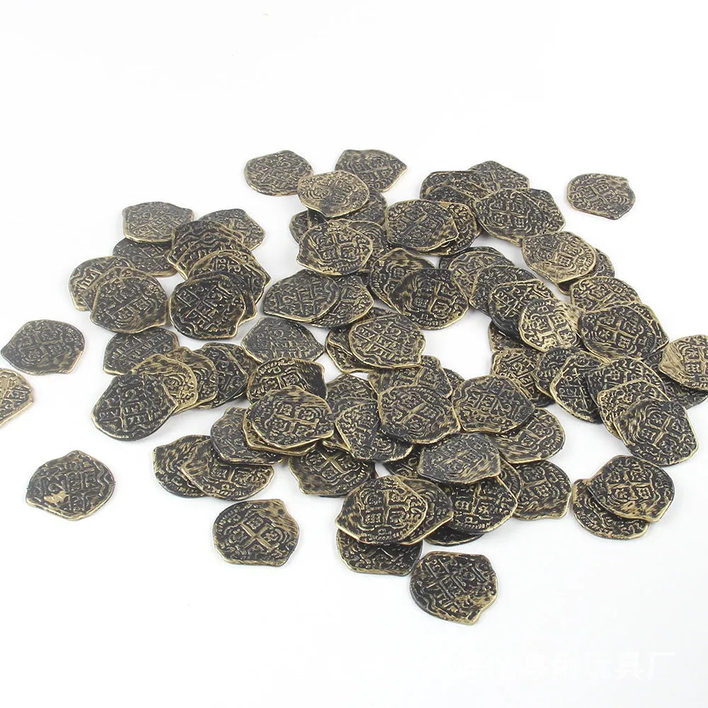 A pile of gold, silver, and bronze coloured plastic Roman coin replicas from a 100-coin bulk pack.