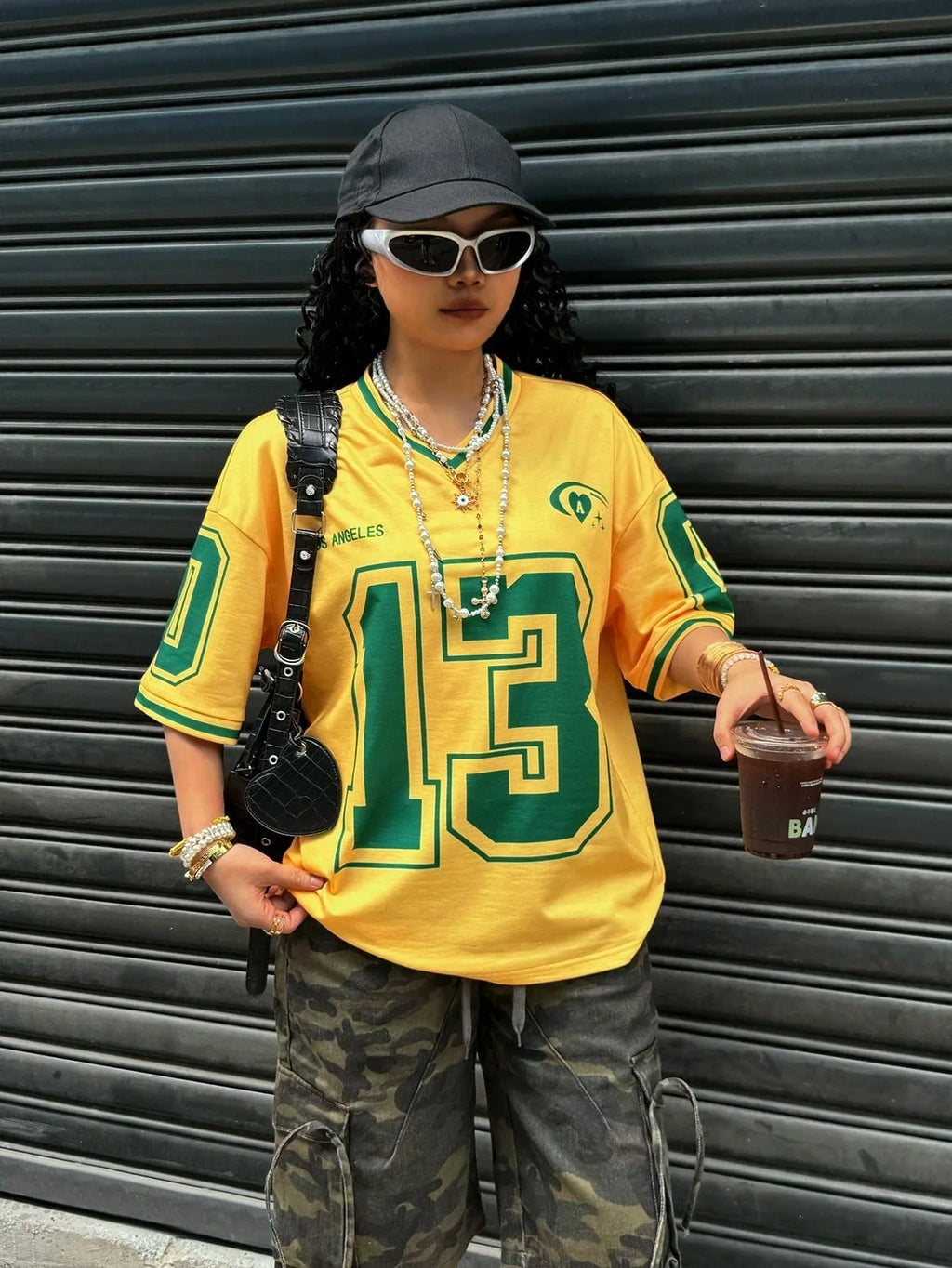 Women's loose-fit V-neck short-sleeved T-shirt with a white 3D letter print design.