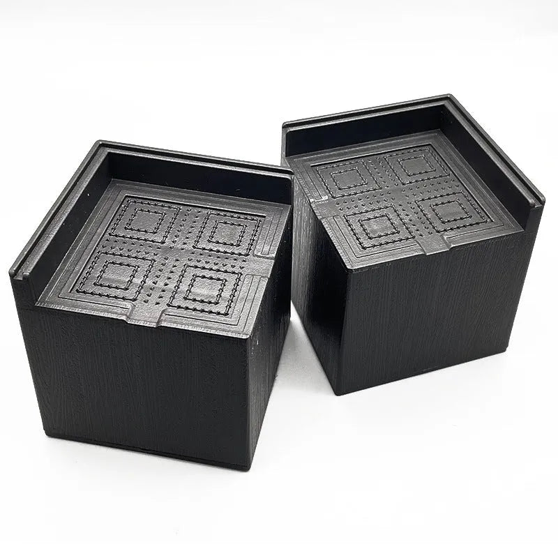 Four black thickened plastic furniture foot mats for raising sofa and bed height