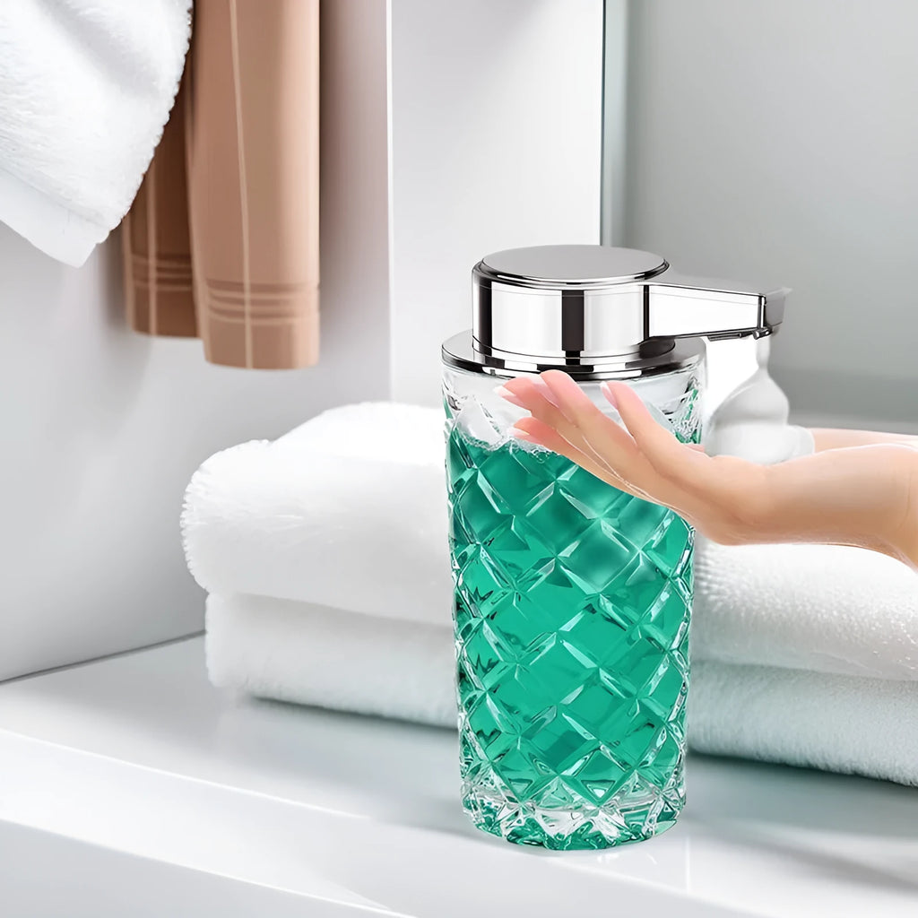 Silver automatic sensor soap dispenser with type-c charging port on a bathroom counter.