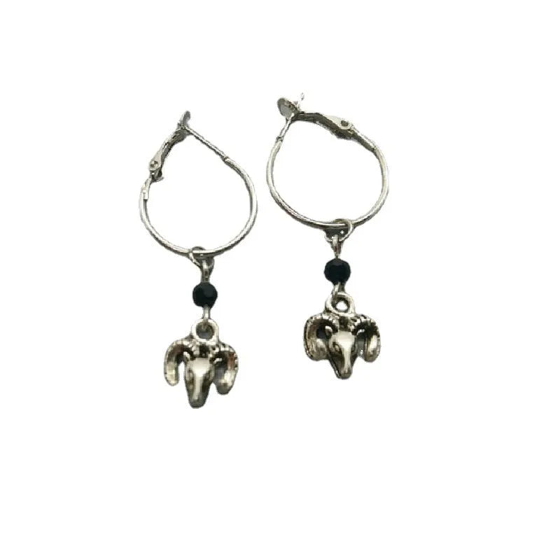 Silver-coloured alloy round hoop earrings for women with a Tibetan antelope design detail.