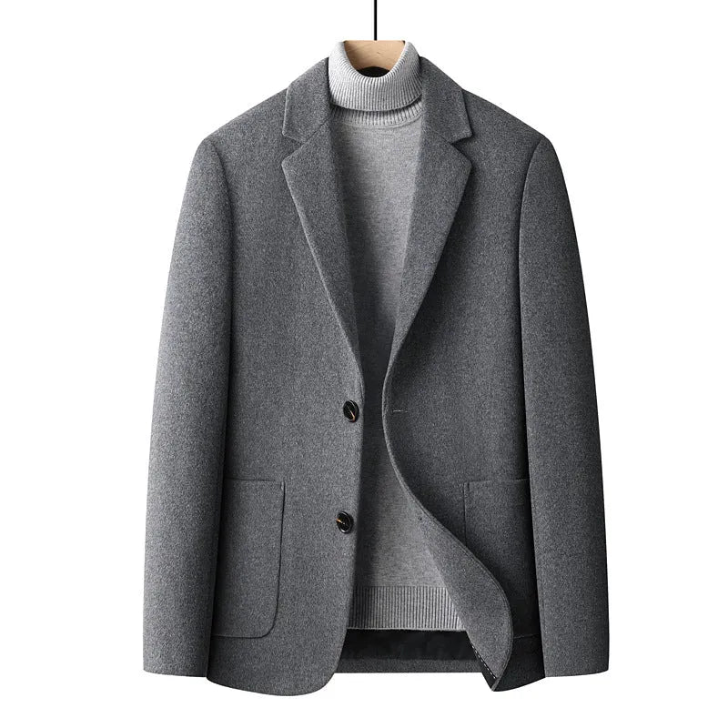 Men's grey slim fit wool suit jacket with a non-ironing finish on a hanger.