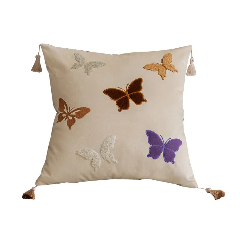 Square beige cushion with embroidered black butterfly pattern in Chinese style.