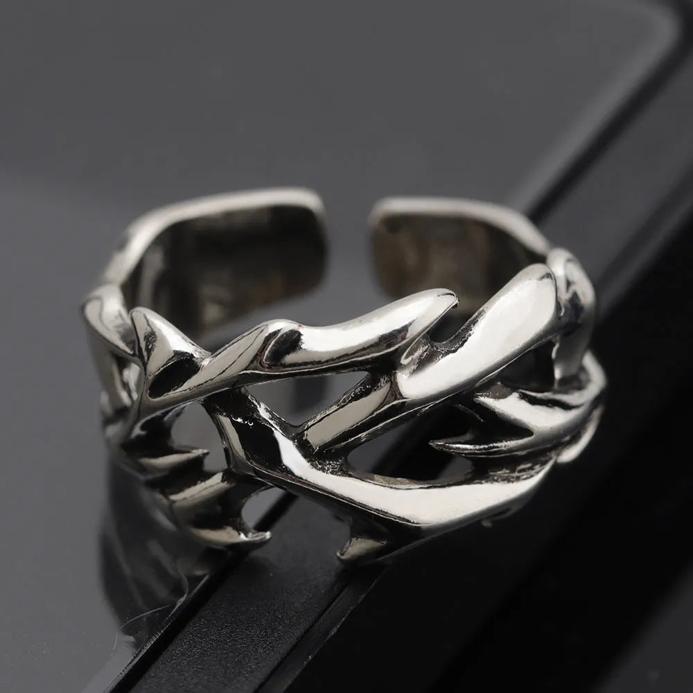 Copper men's ring with geometric thorn flower design and adjustable opening in J2150 thorns colour.