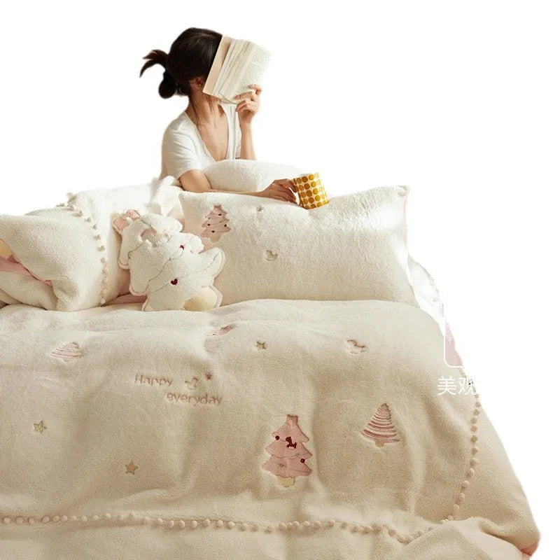 Milk fibre four-piece bedding set with green Christmas tree pattern on a double bed.