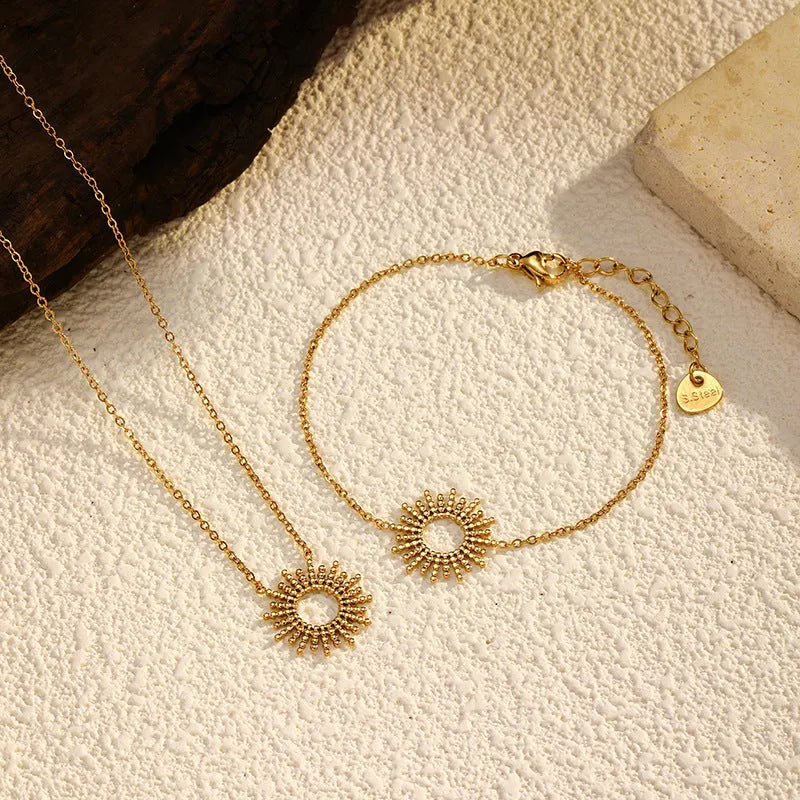 Sunflower Series women's gold necklace and bracelet set with geometric chain design.