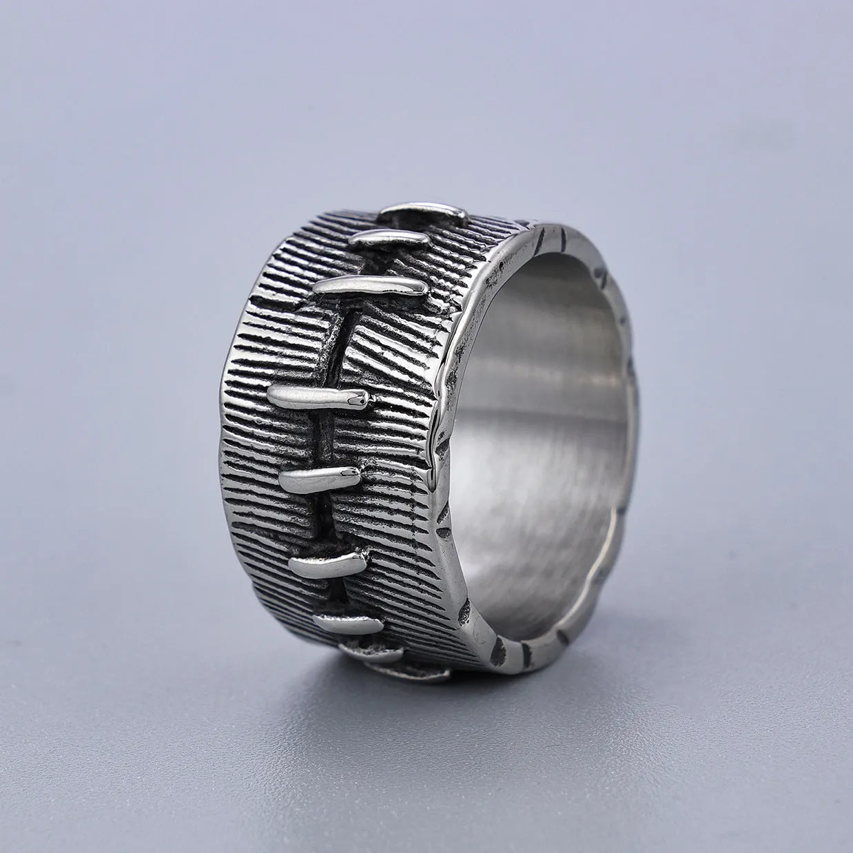 Geometric titanium steel dark punk double ring in a U-shape, shown in a retro colour.