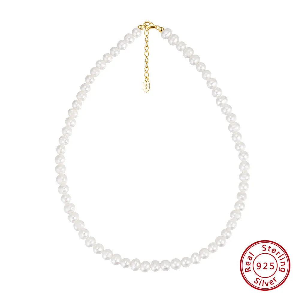 Women's adjustable sterling silver necklace with natural freshwater pearls.
