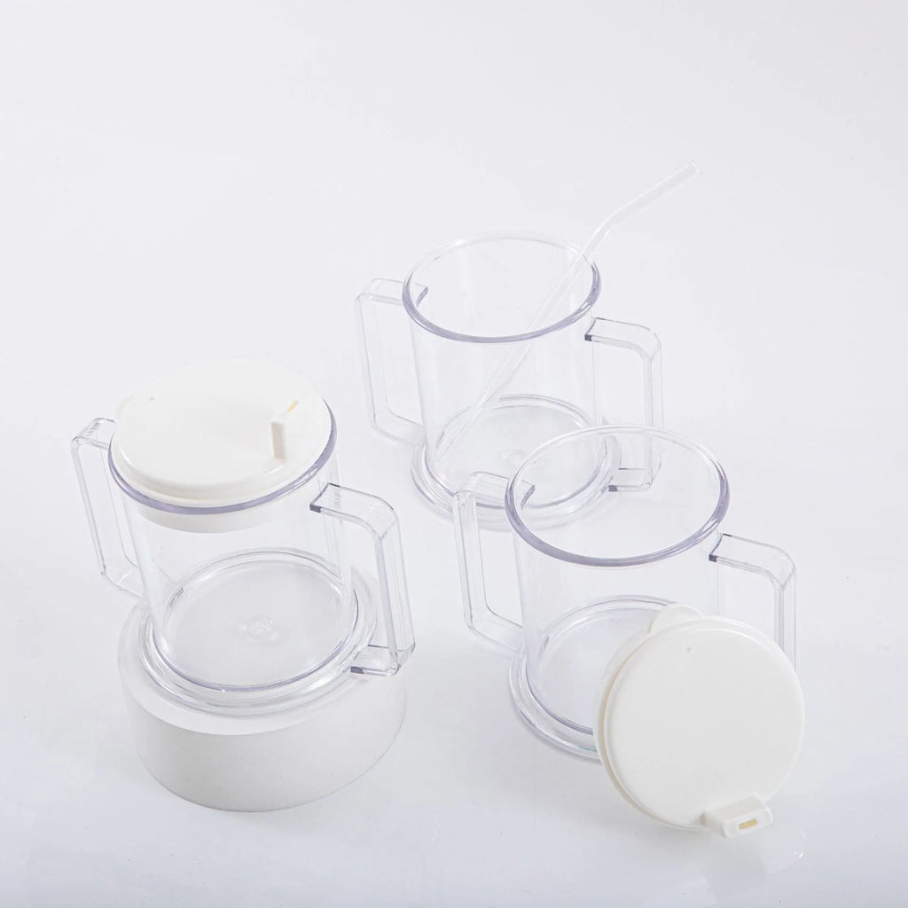 Transparent spill-proof plastic drinking cup on a plain background