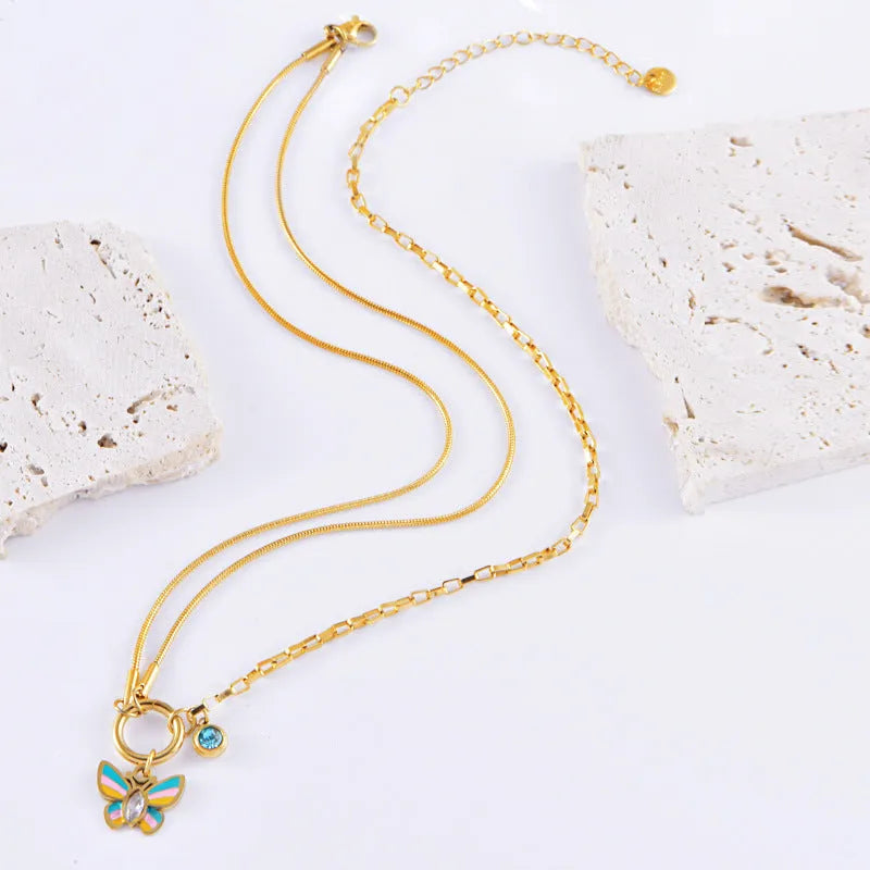 Gold titanium steel butterfly necklace and bracelet set with colourful epoxy pendants on snake bones chains