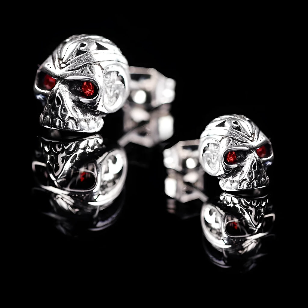 Skull stud earrings with red eye ghost head design and artificial gemstone inlay detailing