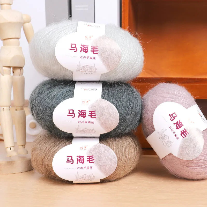 A 200g ball of mohair Inverness thread in a chosen colour, next to a measuring tape showing 180cm for the finished scarf length.