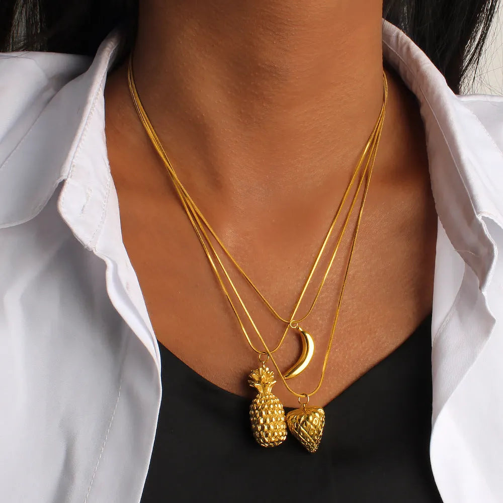 Stainless steel necklace with a detailed red apple enamel pendant on a silver chain.