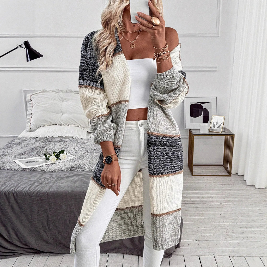 Grey striped knitted cardigan with long sleeves and loose fit street fashion style
